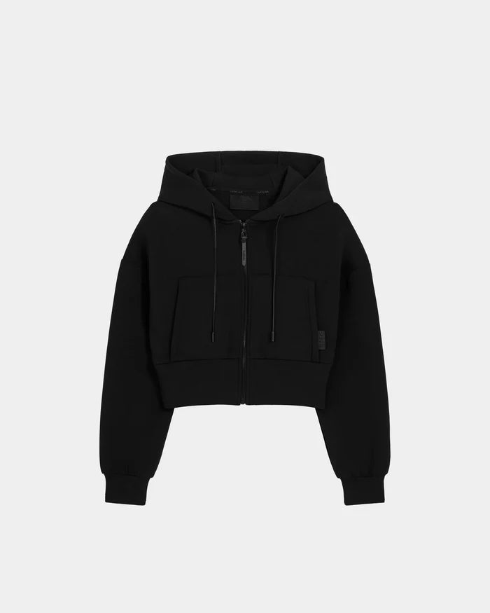 The Rudsak ALAYA - 8525038 Black is a women’s cropped zip-up hoodie with front zipper, two large pockets, hood with drawstrings, and long sleeves—ideal for casual-chic loungewear, shown on a plain white background.