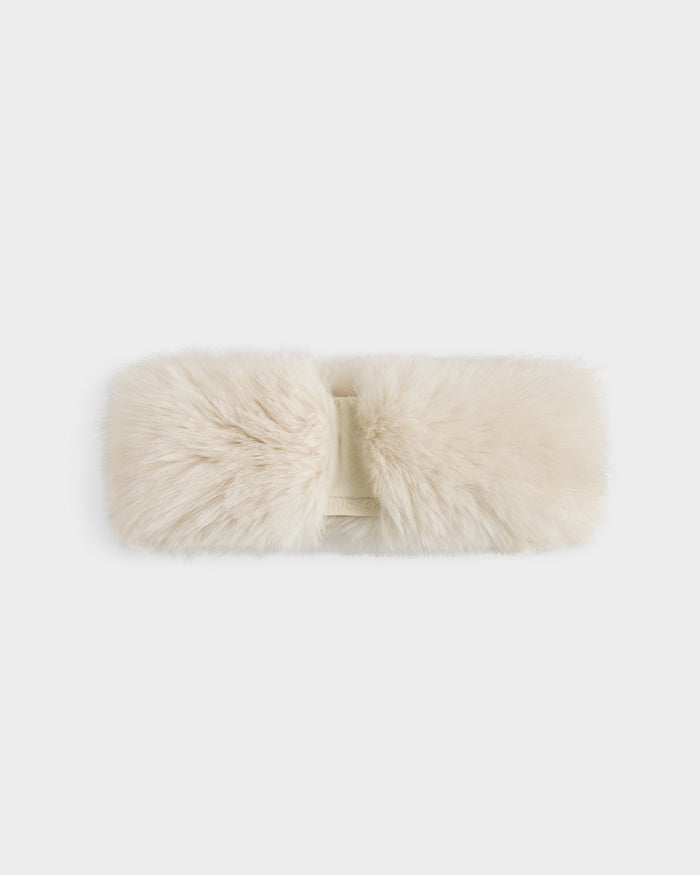 The Rudsak ARLETTE - 8425544 Vanilla women's faux fur headband in cream, with a soft plush texture and twisted center design, is displayed on a plain white background—perfect as a cozy-chic winter accessory.