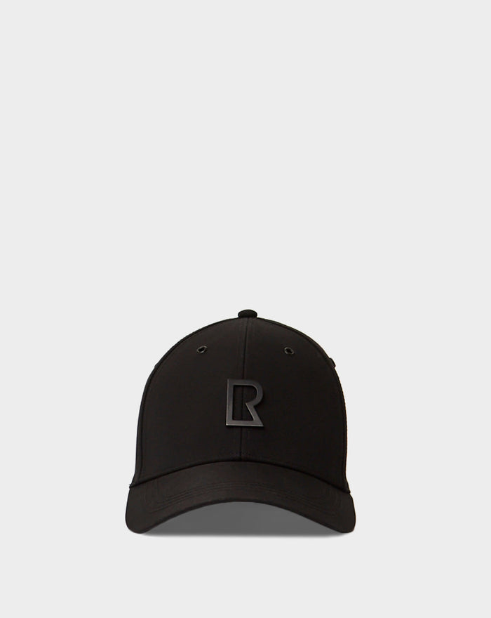 The ARSENE - 9422504 Black by Rudsak is a black unisex adjustable baseball cap featuring a raised black R logo on the front, shown against a plain light gray background for sleek everyday style.