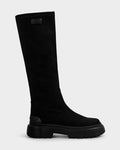 The AVOLA - L225514 Black by Rudsak is a women’s knee-high city boot in sleek faux-suede, featuring a chunky sole and small rectangular label at the top, shown on a plain white background.