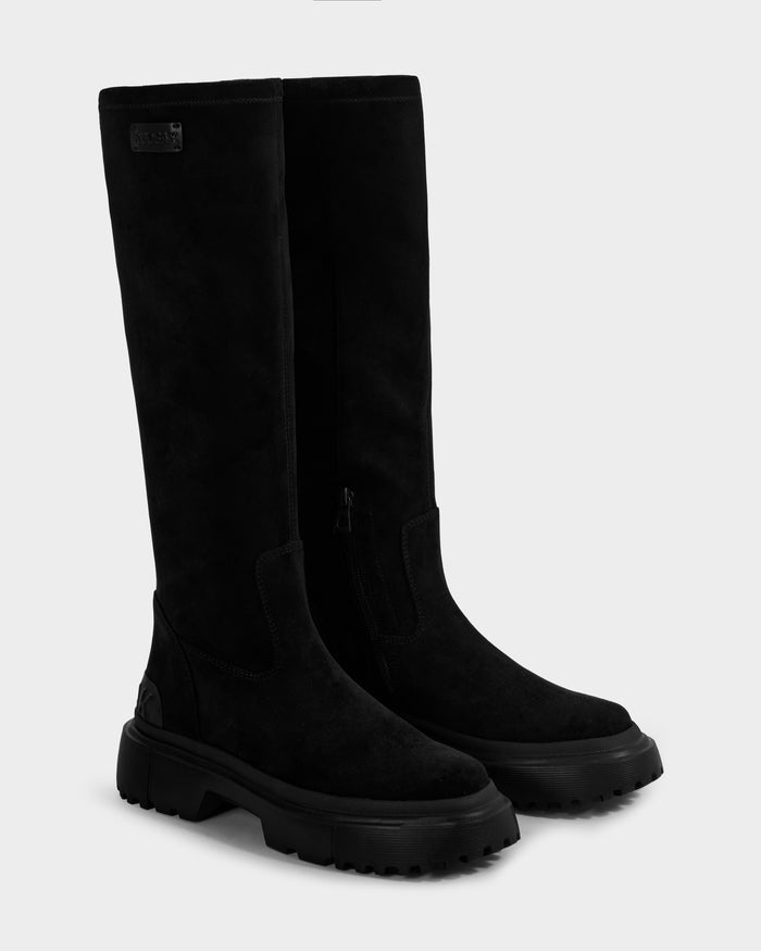 AVOLA - L225514 Black by Rudsak: tall black women’s knee-high boots in faux-suede with chunky rubber soles and a side zipper, shown against a plain white background.