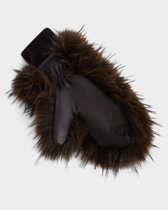 Stay warm in style with the BELLA - 8425006 Mix Espresso mitten by Rudsak. This cozy brown leather accessory features a black ribbed cuff and a fluffy brown faux fur trim, making it one of the coziest faux fur mittens for chilly days. Shown against a white background.
