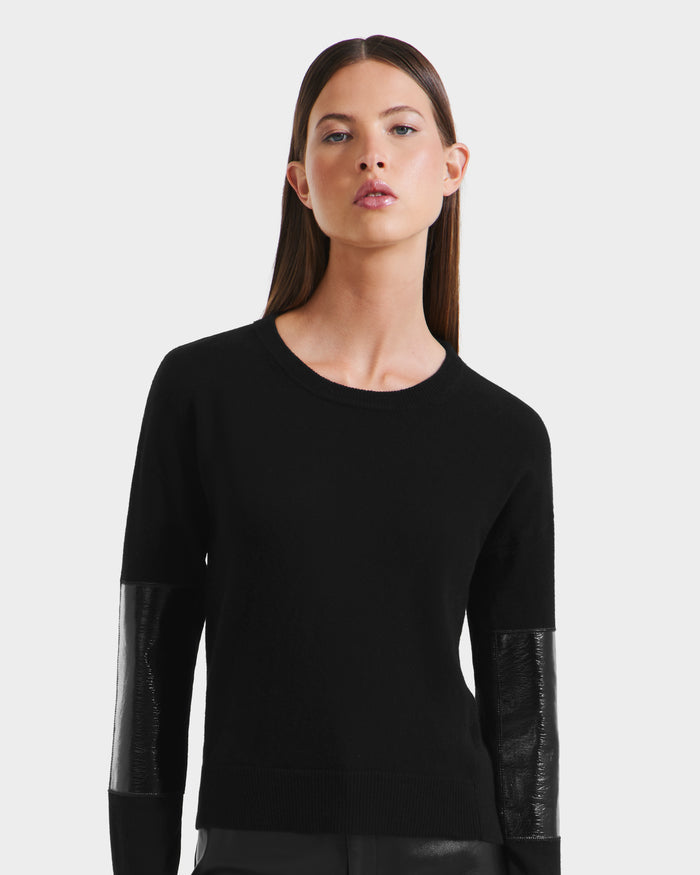 A woman in a Rudsak BELLEROSE - 8525554 Black women’s wool sweater.