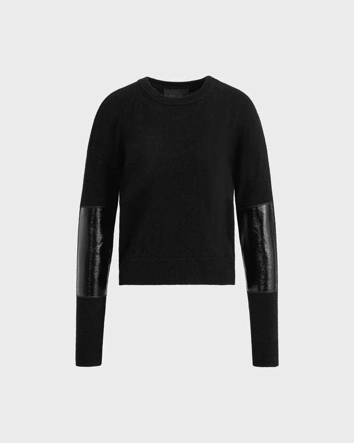 The BELLEROSE - 8525554 Black women’s wool sweater by Rudsak features a crew neckline and shiny black leather-like patches on the lower sleeves, shown against a plain white background.