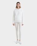 A person faces forward in the Rudsak BRIAR - 9525001 Iceland W hoodie, leggings, and sneakers—crafting a clean, casual style against a plain white background.