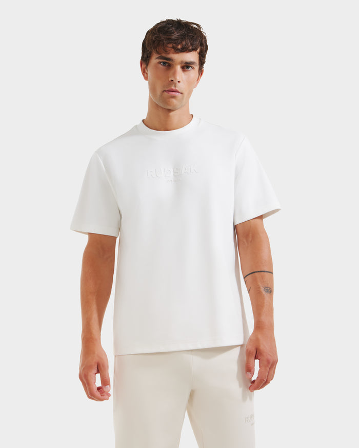 A man wearing a Rudsak CASEY - 6525037 Optic White mens T-shirt.