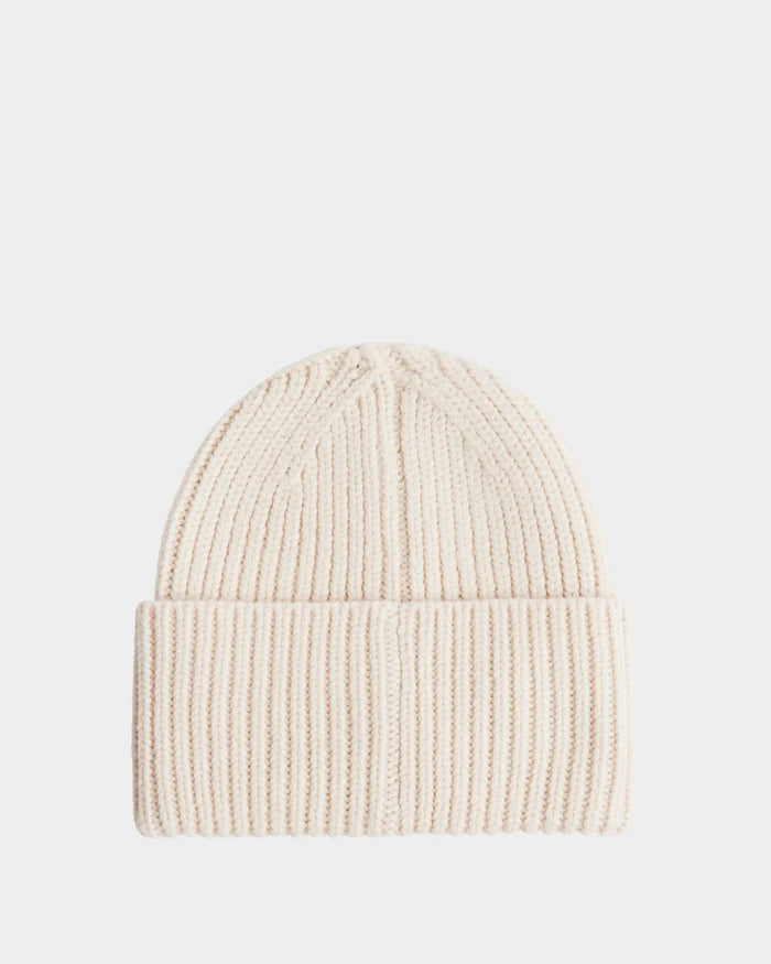 The COLIN - 9424518 Vanilla beanie by Rudsak is a cream ribbed knit unisex hat, crafted from soft merino wool with a folded brim, shown on a plain white background.