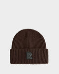 The Rudsak CYBELLE - 9424504 Espresso is a brown ribbed unisex knit hat with a folded cuff and a black R patch on the front, shown on a plain white background—the perfect winter beanie.