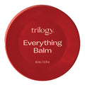 Red container of Trilogy Everything Balm on a white background.