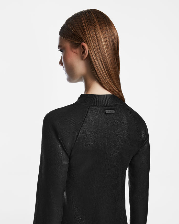 A person with straight, long brown hair is seen from behind wearing the Rudsak FAIZA - 8524579 Black jacket against a plain white background, emphasizing the jacket's polished texture and hair details.