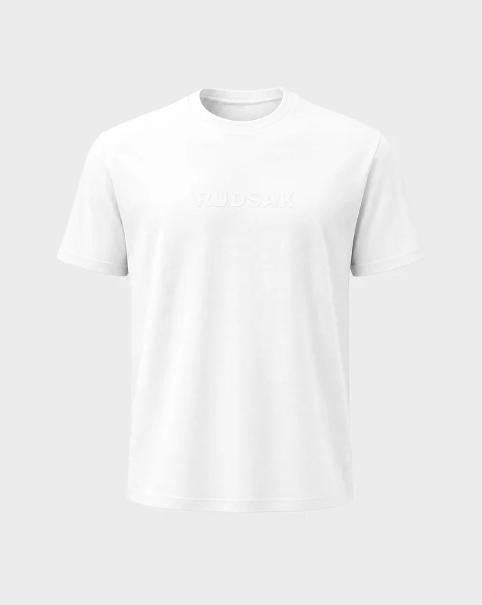 The FERDI - 6522005 t-shirt by Rudsak in Natural White features short sleeves, a round neckline, and subtle embossed RUDSAK text across the chest, displayed against a light gray background.