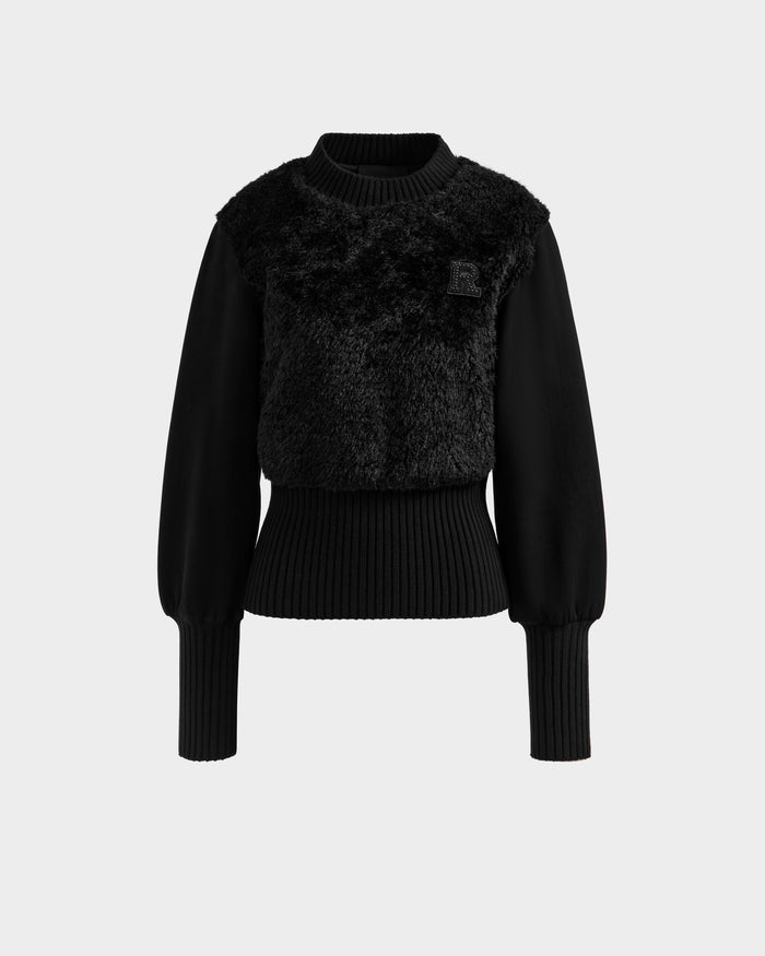 The FLORENCE - 8525546 Black by Rudsak is a women's long-sleeve faux fur top featuring a soft textured front, ribbed cuffs and waistband, and a crew neckline—perfect for adding modern cozy style to your après-ski wardrobe.