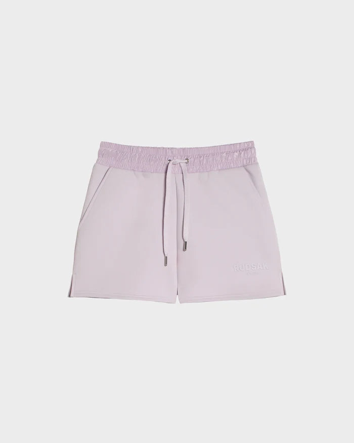 Light purple GENEVA - 8524070 Lilac Foam women's shorts by Rudsak in double jersey with an elastic drawstring waistband, side pockets, subtle stitching, and a small “RUDSAK” logo on the lower right leg. Shown on a white background.