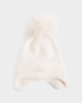 A white knit winter hat from Rudsak, the ICE - 8426519 Vanilla, featuring a large fluffy pom-pom on top, ear flaps, a fold-over cuff, and a small rectangular patch on the front.