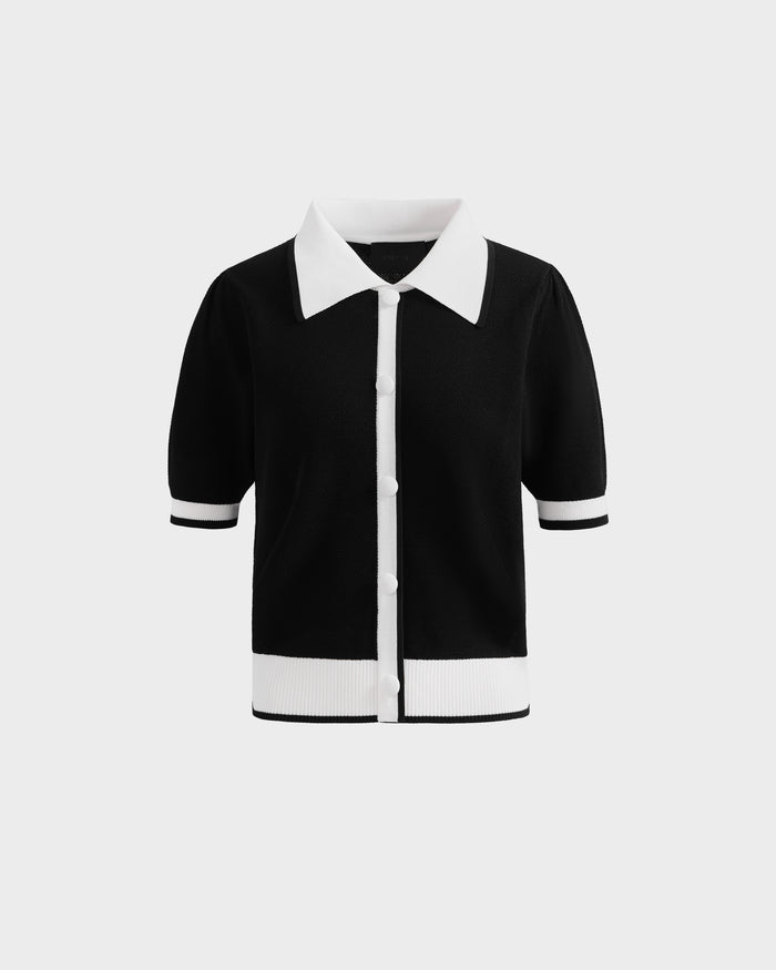 The Rudsak IRIS - 8526012 Black is a black knit short-sleeve sweater with a contrast collar, white buttons, and white trim at the sleeves and hem, shown on a plain light background.