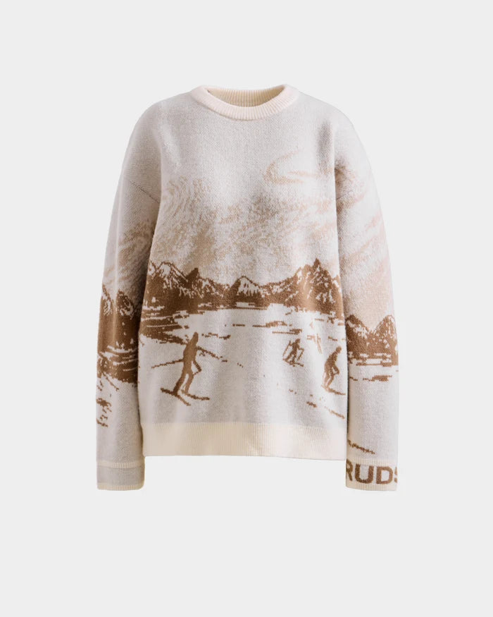 The Rudsak IZZY - 9525557 Iceland M is a cream and light brown unisex knit crewneck sweater with a ski mountain motif, skiers, and snow. This après-ski-inspired design features long sleeves and a round neckline.