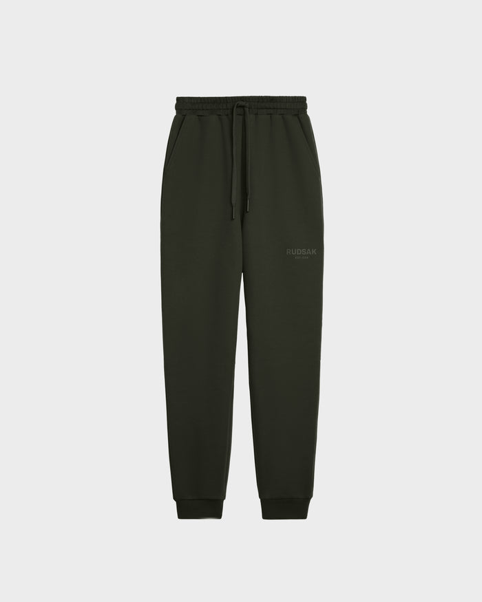 The Rudsak JOSS - 9524009 Dark Olive W unisex jogger sweatpants feature an elastic waistband, drawstring, side pockets, and ribbed cuffs in premium cotton. Shown on a plain white background.