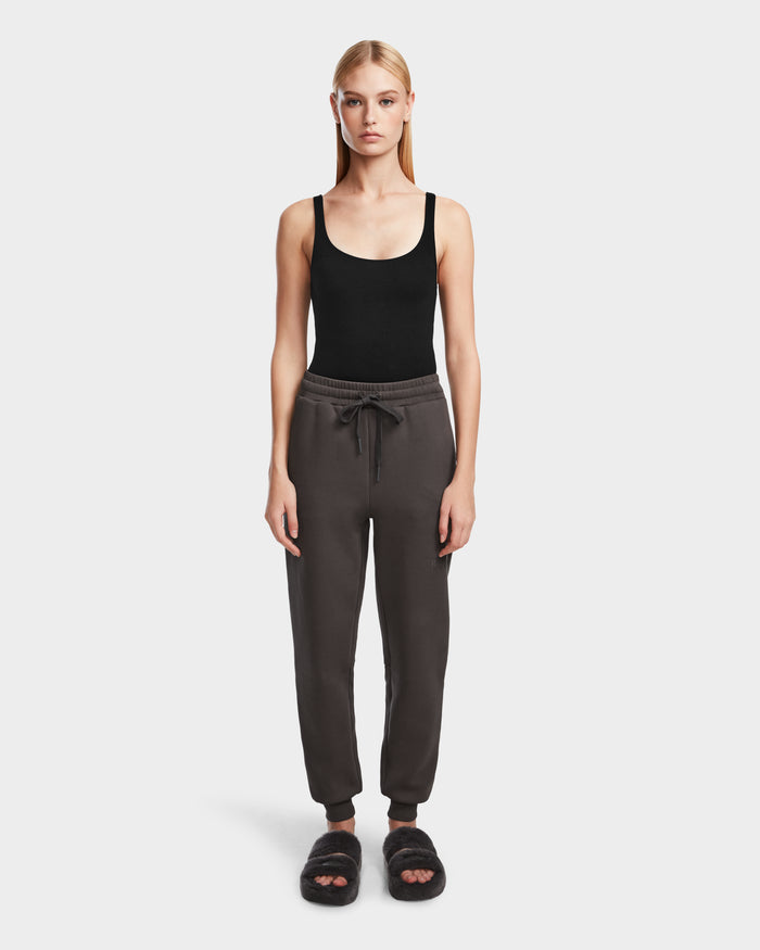 A woman stands facing forward, wearing Rudsaks JOSS - 9524009 Grey W joggers against a plain white background.