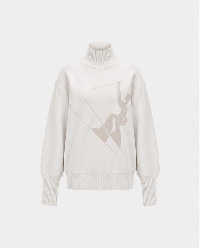 The JOYCE E - 8526538 Vanilla turtleneck sweater by Rudsak features ribbed cuffs and hem, adorned with a minimalist abstract figure print on the front. Infused with alpine spirit, this cozy vanilla-hued piece exudes après-ski elegance and is showcased against a plain white background.