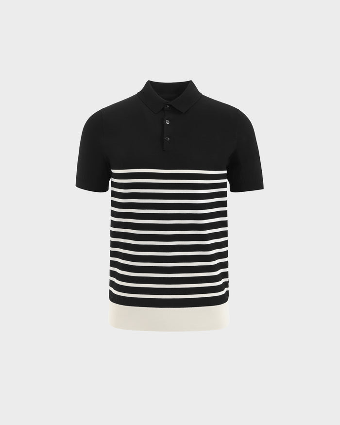 The KRIS - 6526005 Black by Rudsak is a short-sleeve, fine-gauge knit polo with a collar and buttons, featuring horizontal white contrast stripes on the lower half and a solid white band at the hem against a light gray background.