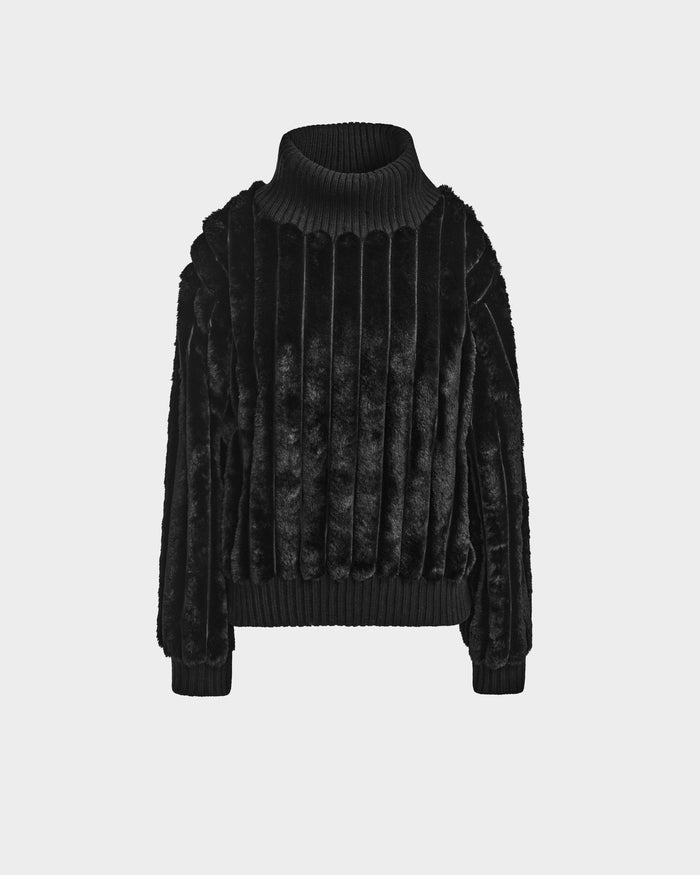The LAYLA - 8524610 Black by Rudsak is a women’s faux fur turtleneck sweater with vertical textured lines, ribbed cuffs, and a plush feel—ideal for adding a touch of luxury to any look.