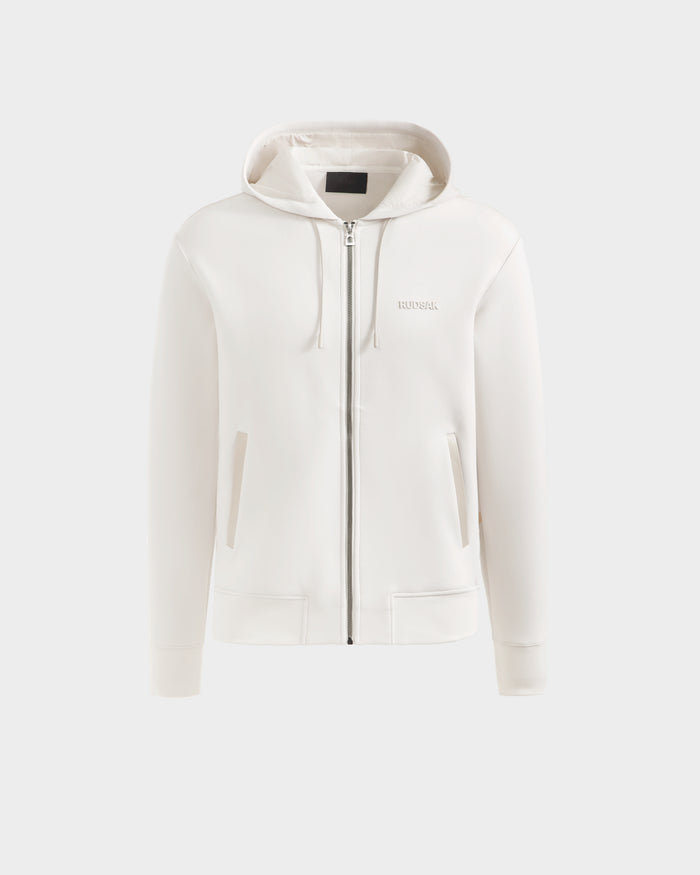 The Rudsak LEVI - 9525552 Vanilla W is a unisex zip-up hoodie with a hood, drawstrings, front pockets, vegan leather trims, and a subtle left-chest logo. Shown against a plain light background for an elevated basics look.