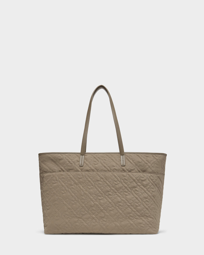 The Rudsak LIVORNO - L325007 Almond is a quilted monogram tote with two long handles and a rectangular shape, shown on a plain white background.