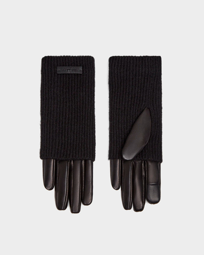 The Rudsak MARINE - 8424516 Black/Black women's gloves pair smooth leather on the fingers and palms with ribbed knit cuffs, shown side by side on a plain light background for a chic fall accessory look.