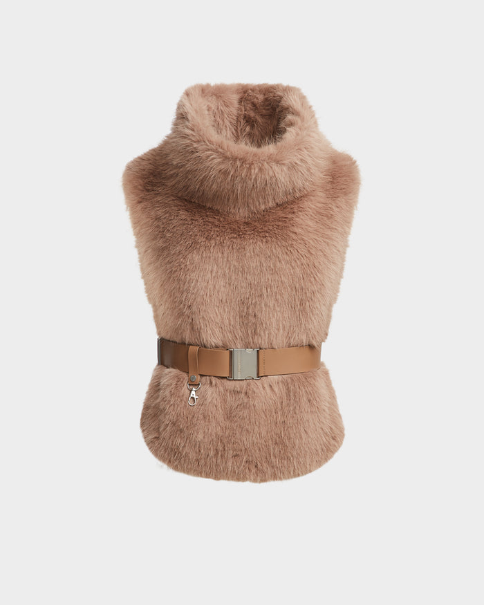 The Rudsak MAULIN - 8524611 Camel is a sleeveless, light brown faux fur vest with a high mock-neck collar, cinched at the waist with a tan vegan leather belt and silver clasp. Shown against a plain white background.