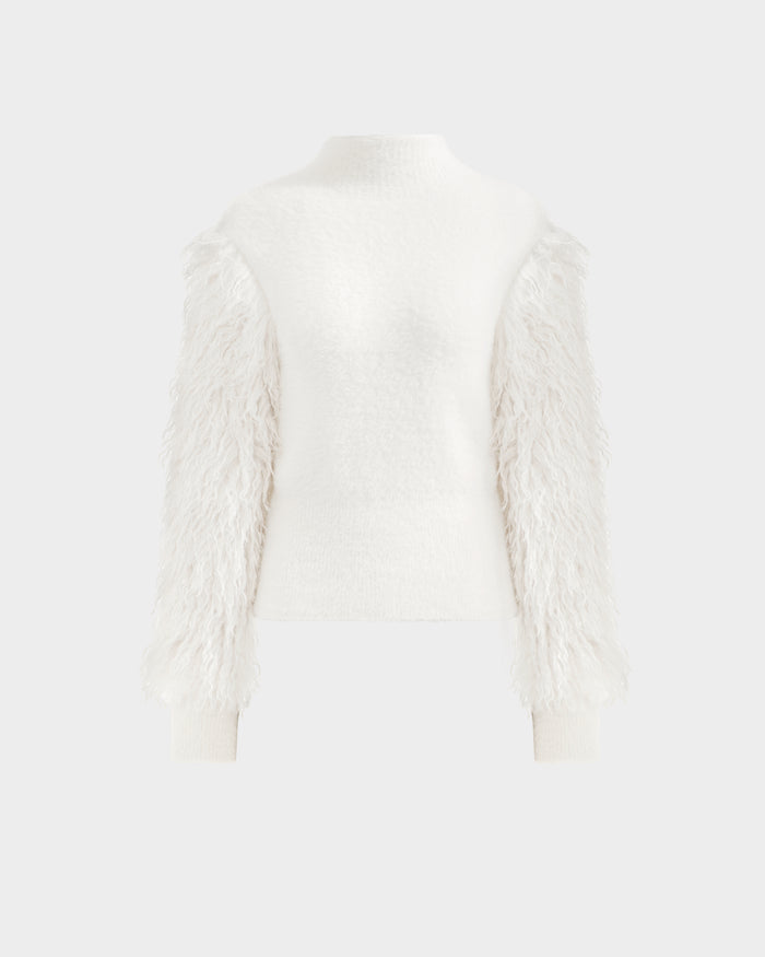 The Rudsak NOEL - 8525571 Vanilla is a white women's mock-neck sweater with a fitted torso and textured faux fur sleeves, perfect for winter styling; shown on a plain light gray background.
