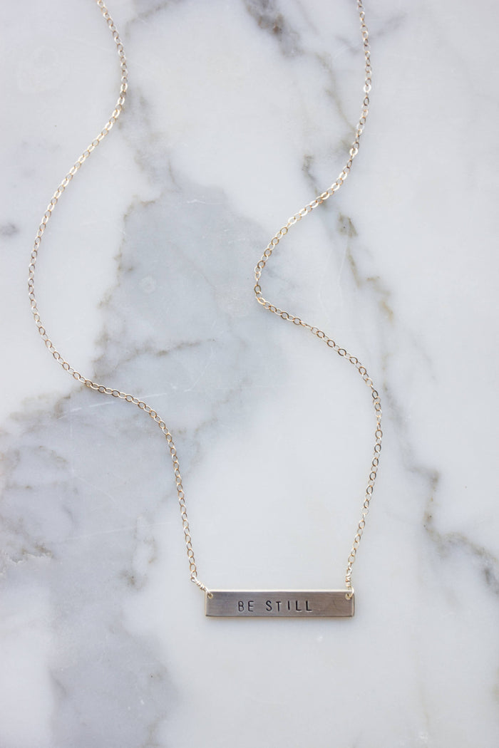 Océanne - 'Be Still' Stamped Bar Necklace: Gold-filled / Arial (default) / Horizontal