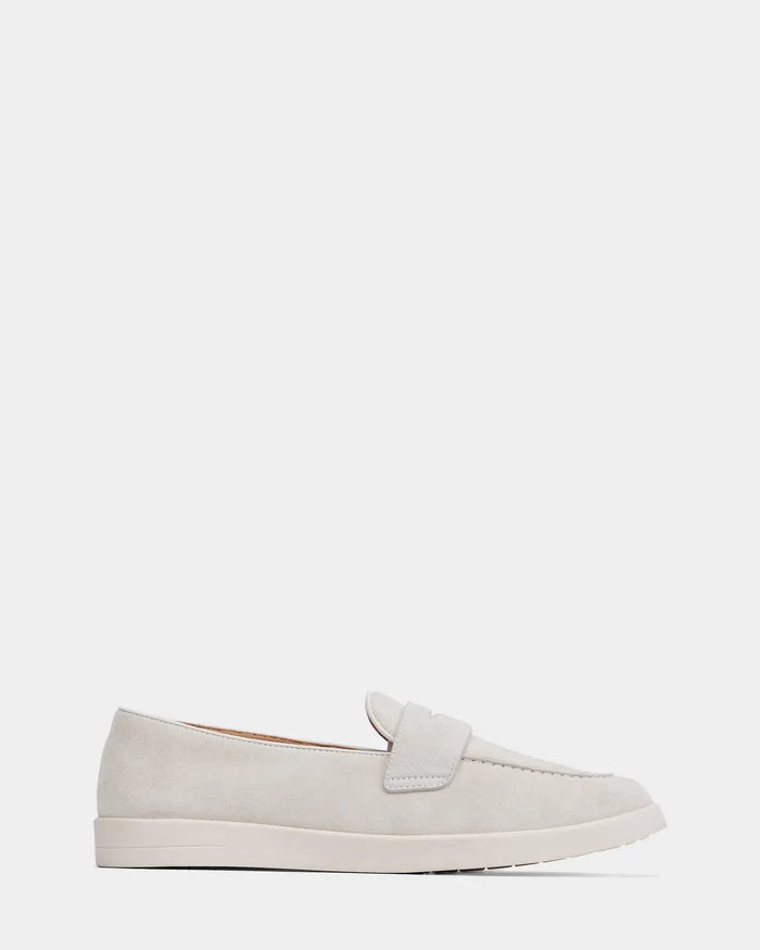 The RABECCA - 8225006 Iceland by Rudsak is a light beige suede slip-on loafer with a low white rubber sole, shown in side view on a plain white background—an elegant option in womens luxury shoes.