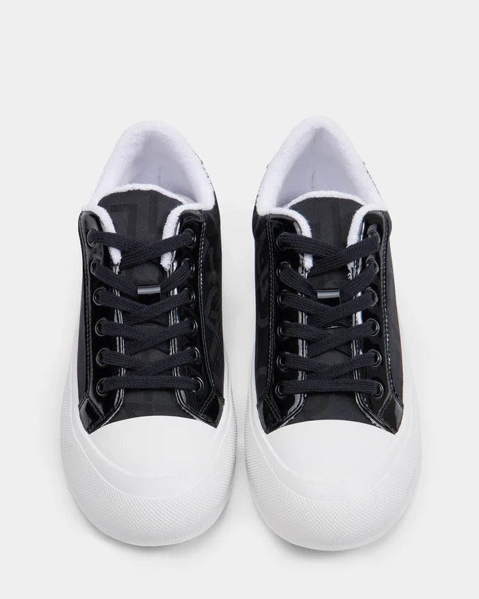 The Rudsak RIMA - 8225001 Black Pattern sneakers feature vegan leather uppers with white rubber toe caps and soles, shown from above on a plain white background.
