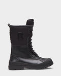 The Rudsak RITA - L222502 Black is a womens winter combat boot in weather-treated leather, featuring a thick treaded sole, high ankle support, pull tab, raised B logo, and a rugged, durable design.