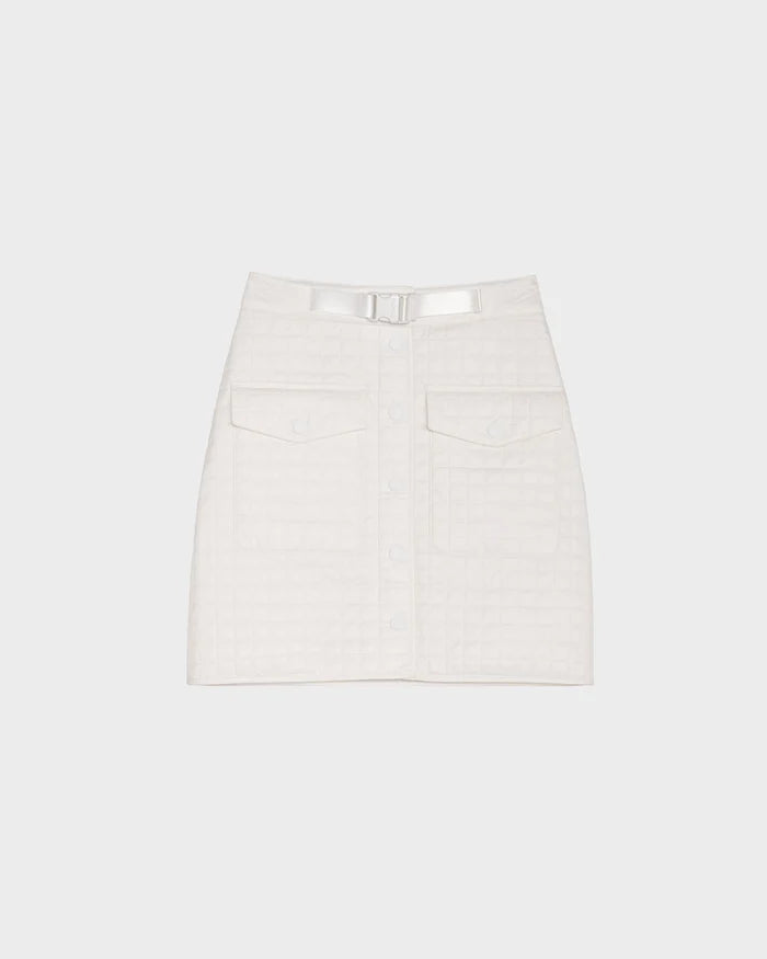The Rudsak SABINE - 8524063 Eggshell is a white quilted short skirt with front buttons, large front pockets, and a matching belt with metallic buckle—an elegant women’s statement piece shown on a plain light background.