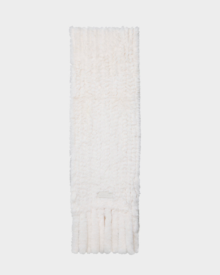 The TAVIA - 8426511 Vanilla scarf by Rudsak is a long, white, fluffy knit accessory with tasseled ends, neatly folded against a plain light background.