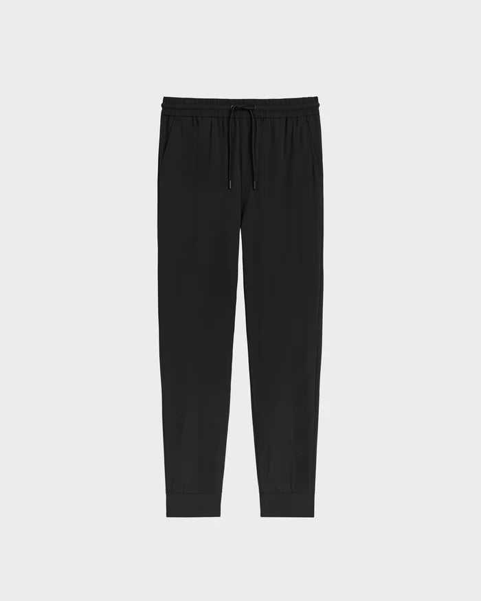 The TUSTIN - 6525029 Black jogger pants by Rudsak feature technical fabric, an elastic waistband, side pockets, and cuffed ankles, shown on a plain light gray background—ideal for mens casual wear.