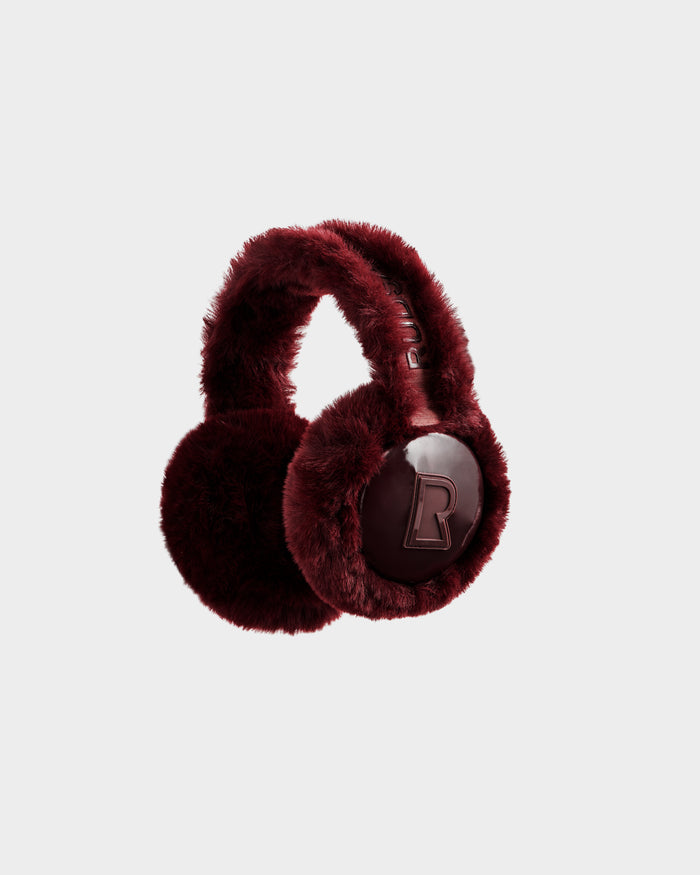 A pair of plush, bordeaux Rudsak VALENCIA - 8425543 earmuffs with a furry texture and bold embossed B logo on the ear cover, showcased against a white background—an essential winter accessory.