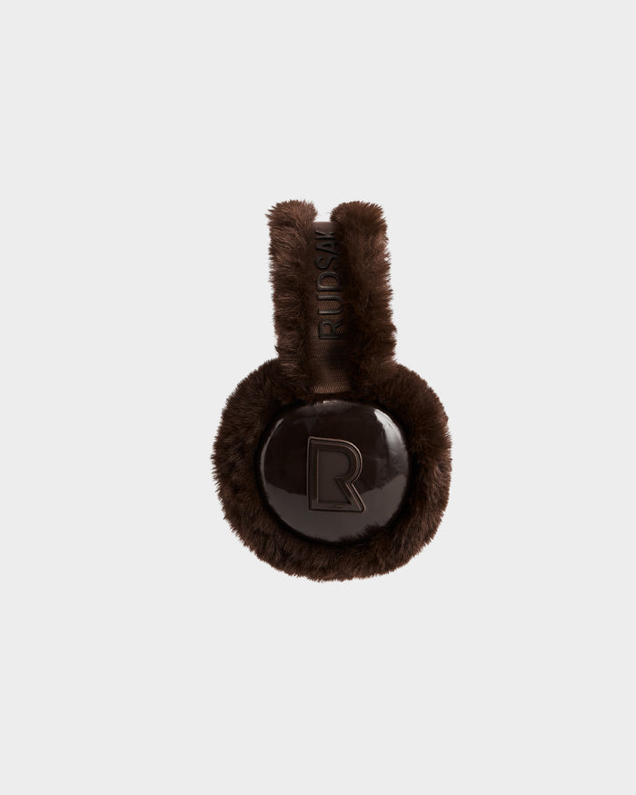 The VALENCIA - 8425543 Espresso earmuffs by Rudsak feature dark brown faux fur, a shiny round center with a raised R logo, and an embossed RIUDSM headband—making them the perfect stylish winter accessory.