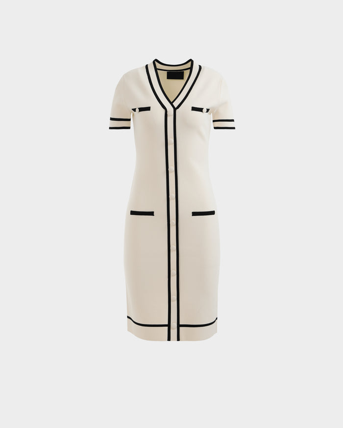 The Rudsak VINNIE - 8526038 Vanilla knit midi dress features a V-neckline, knee-length cut, black trim on the edges, collar, pockets, and front, plus four stylish pocket details for a sophisticated look.