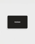 A black rectangular VIRTUAL GIFT CARD by Rudsak International features the white "RUDSAK" logo, centered on a plain white background. Enjoy email delivery and no expiration for maximum convenience.