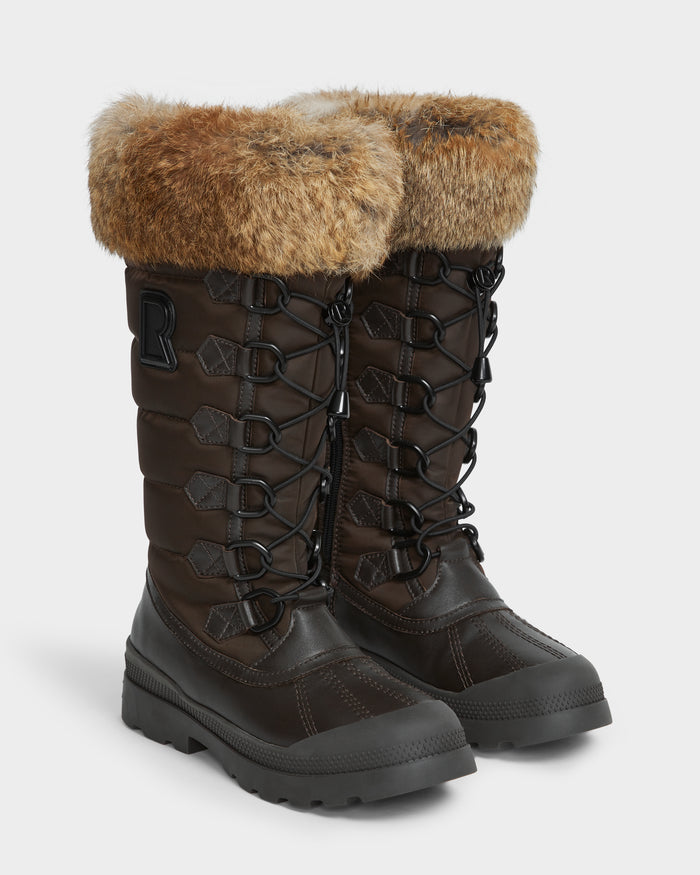 The WINDY - L224507 Espresso by Rudsak are tall, dark brown womens winter boots with black laces, thick rubber soles, faux fur trim, quilted sides, and a large R patch for warmth and style.