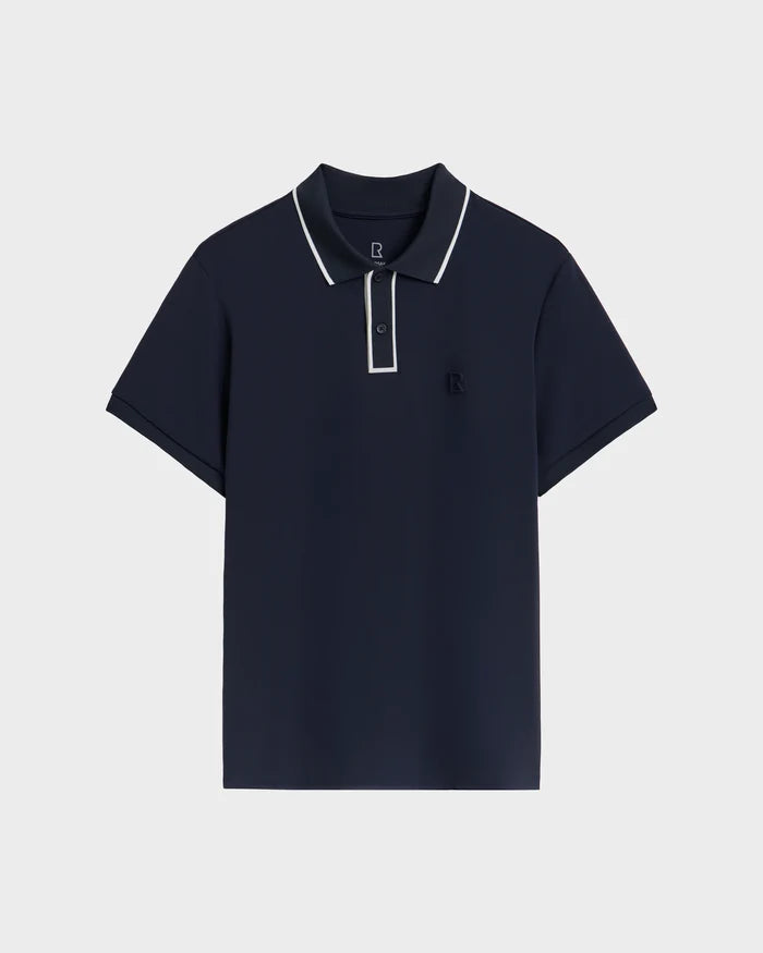 The Rudsak XAVIER - 6524027 Navy mens polo features white trim on the collar and placket, a small chest logo, and is shown on a plain white background.