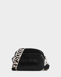 The ZOYA L - 8325543 Black by Rudsak is a smooth black leather crossbody with RUDSAK embossed on the front, silver hardware, a zippered compartment, and a detachable adjustable beige logo strap with bold black lettering.